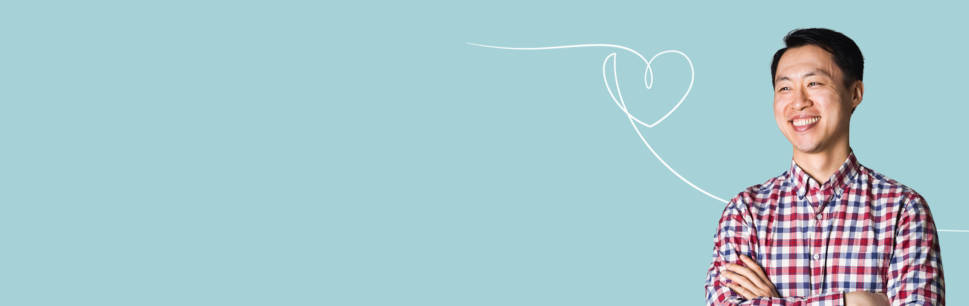 man smiling with arms folded