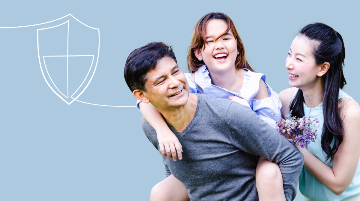 girl on dad back with wife next to him