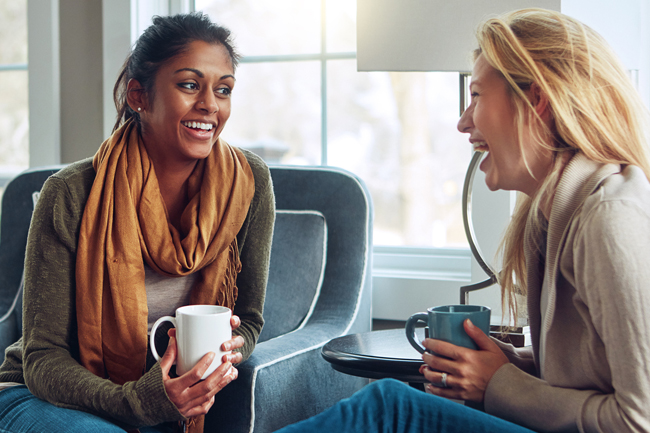 Friends discussing their investment decisions over a coffee