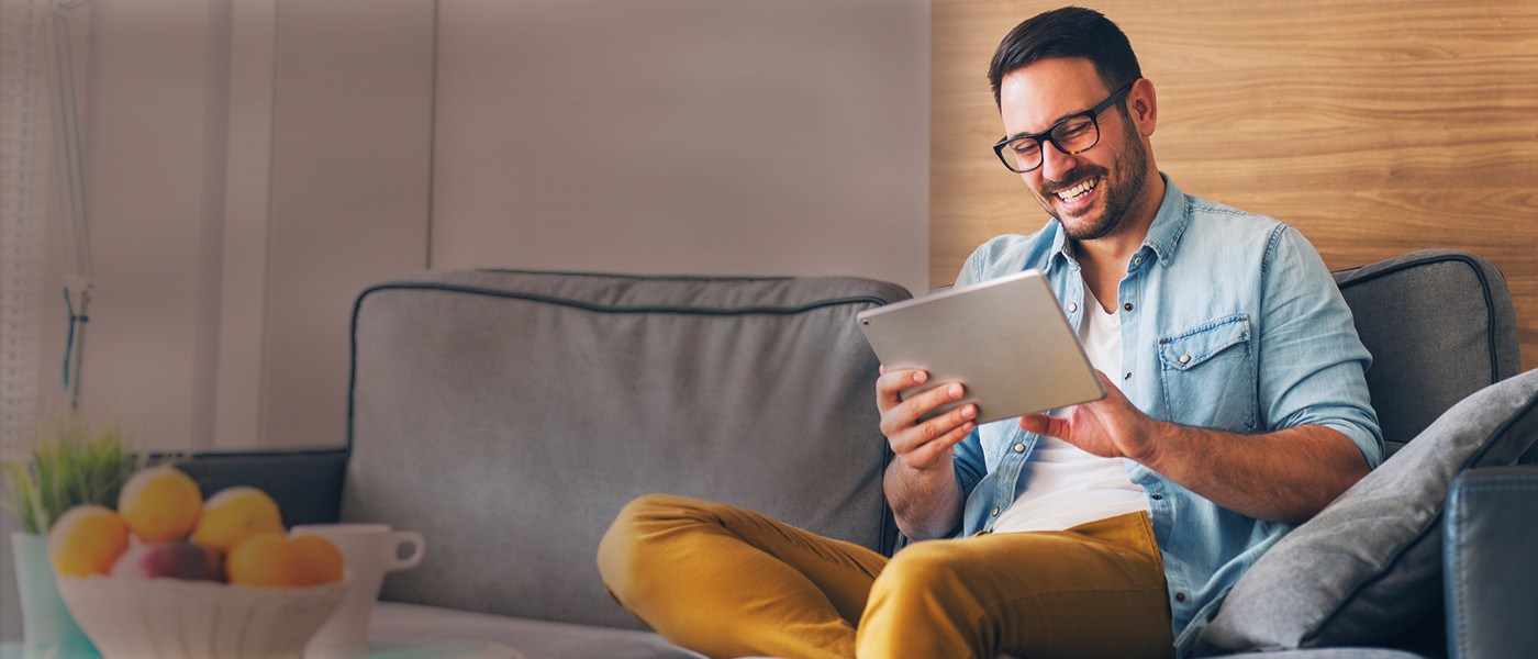 Man on tablet learning about sustainable investing