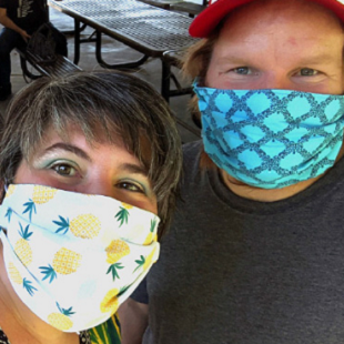 Foresters Care. Man and Woman wearing masks.