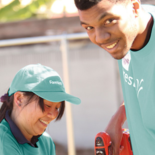 woman and man building a playground together