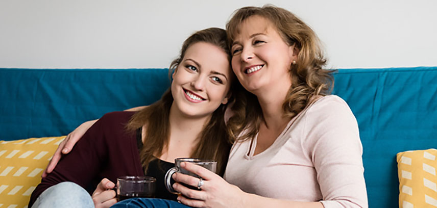Mother and daughter on sofa